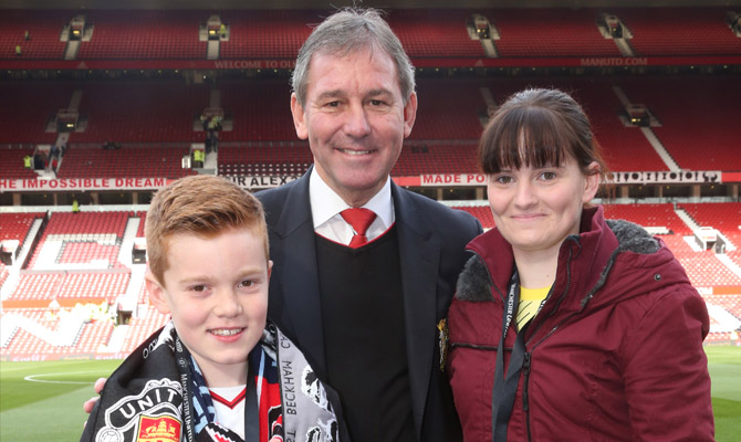 Bryan Robson Handing Over Bulova Watch To Man Utd Social Casino Competition Winner